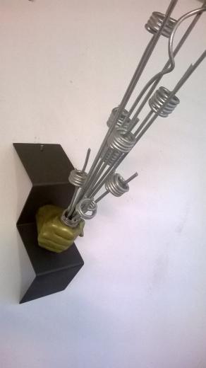 Silver volcan in a gold hand