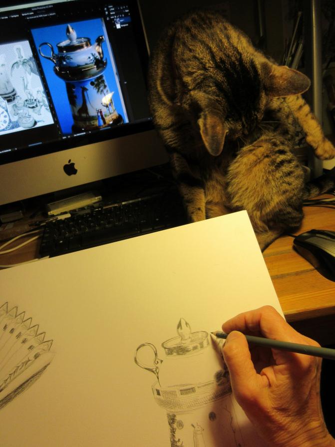 Computer, sketch book and cat