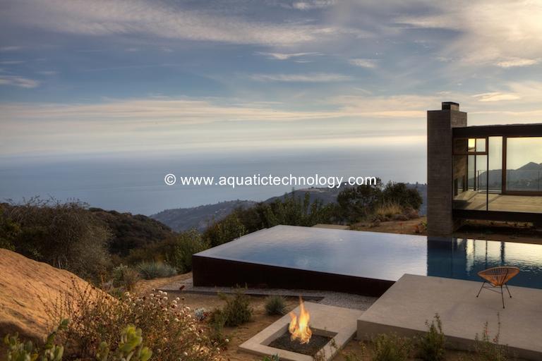 Glass tile perimeter overflow infinity edge pool and spa