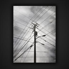 electric pole and gray sky