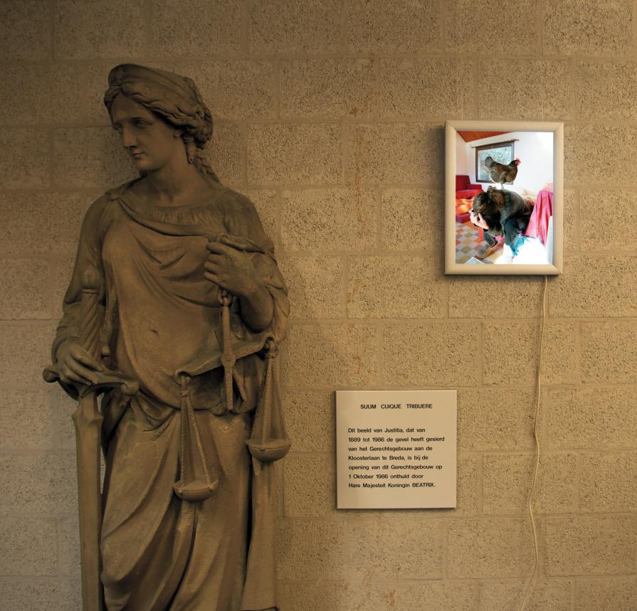 Title: Virtue - Photograph on a light box - Installation (site specific). A light box installed at the statue of Lady Justice. Overview 1.