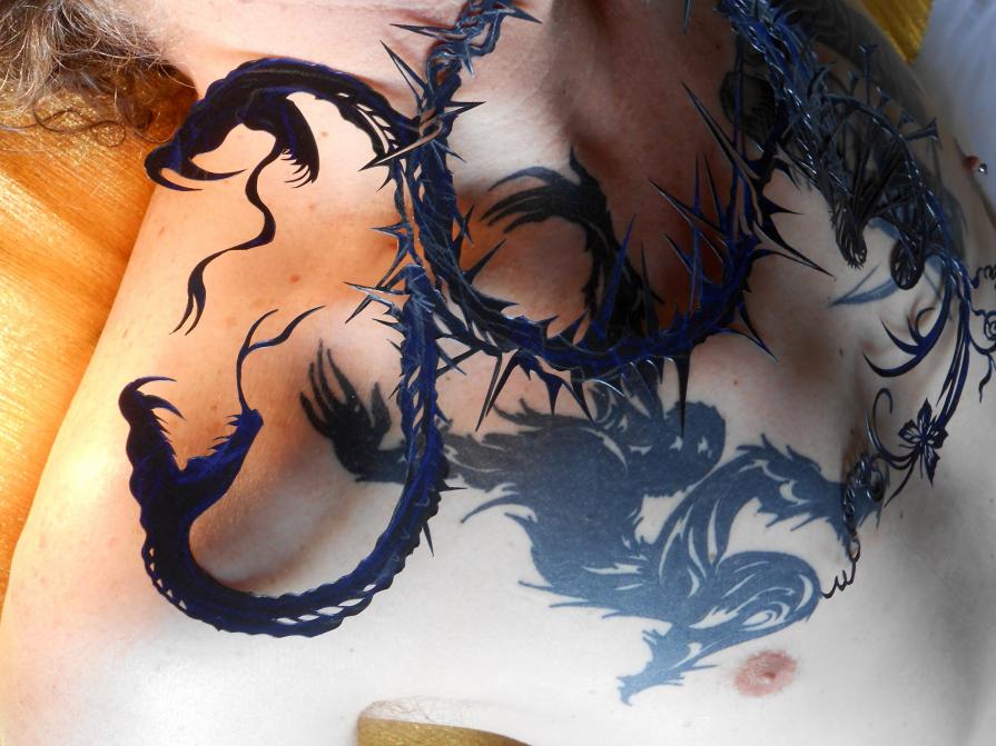 Snakes and Ladders (paper-cut superimposed on tattoo, also based on a paper-cut)